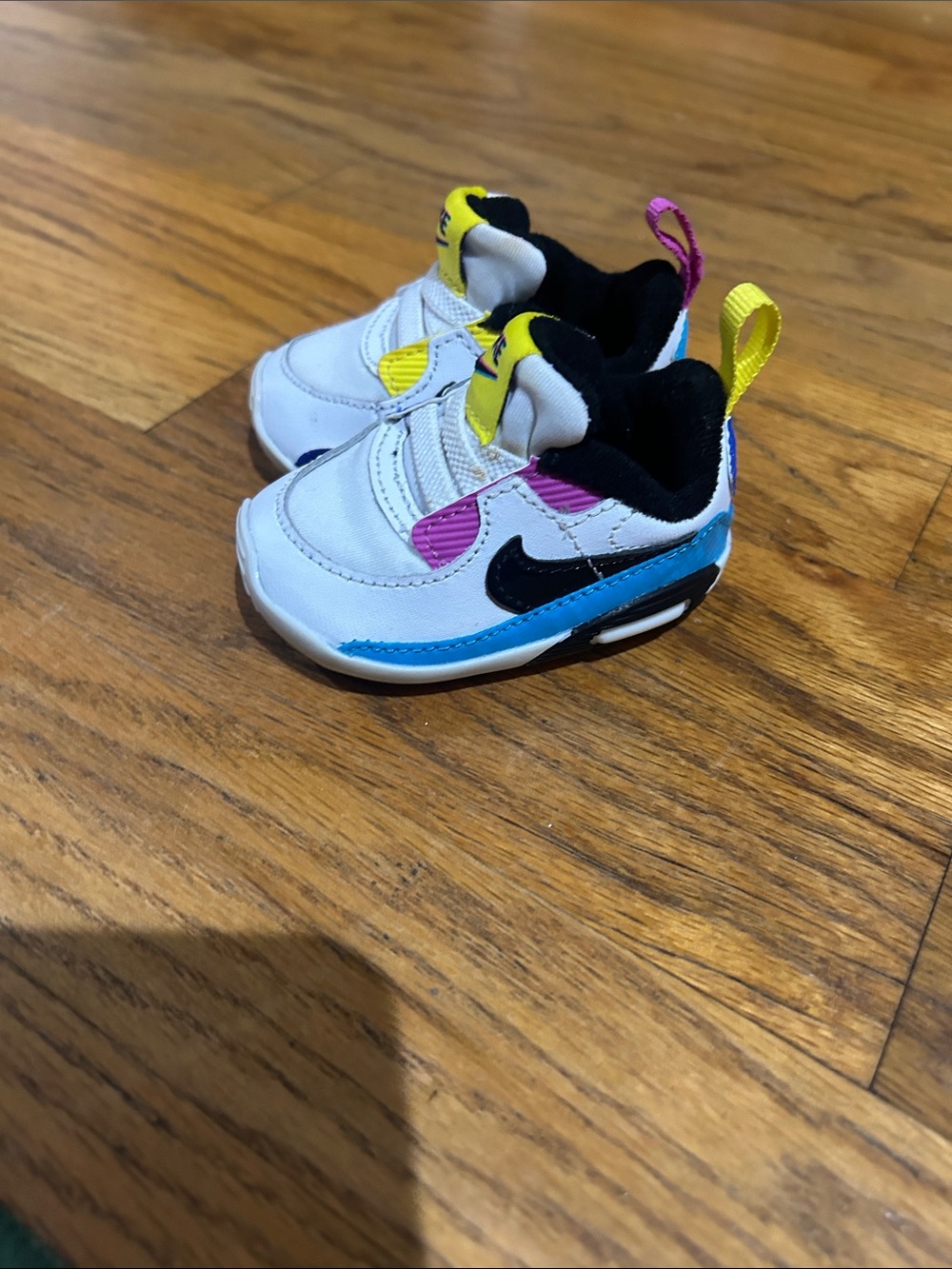 Nike Kids White Sneakers with Black, Blue, Yellow & Pink Accents
